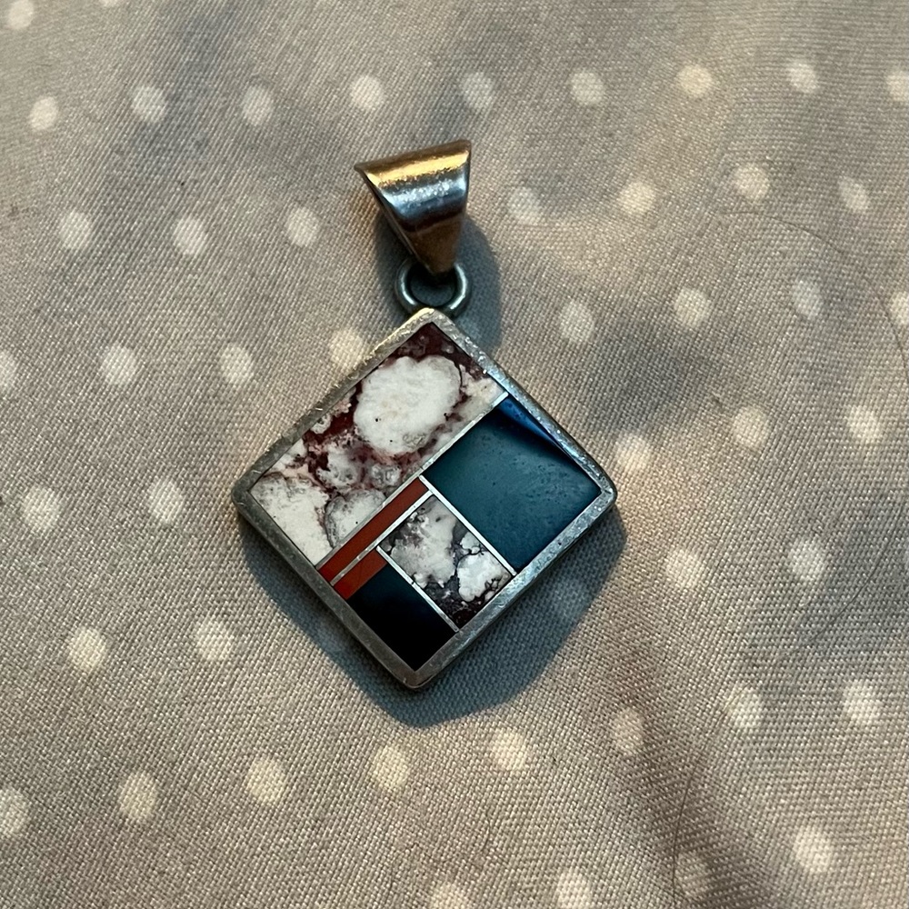Native American handmade, signed and stamped inlaid pendant.